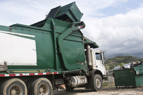 Metal and wood waste being loaded for clearance