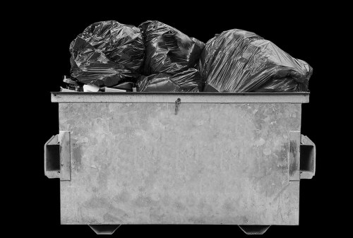 Workers carrying furniture from a flat in Golders Green during a clearance job